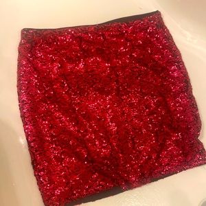Sequin mini skirt by DIVIDED by H and M size med. color is like a dark pink.